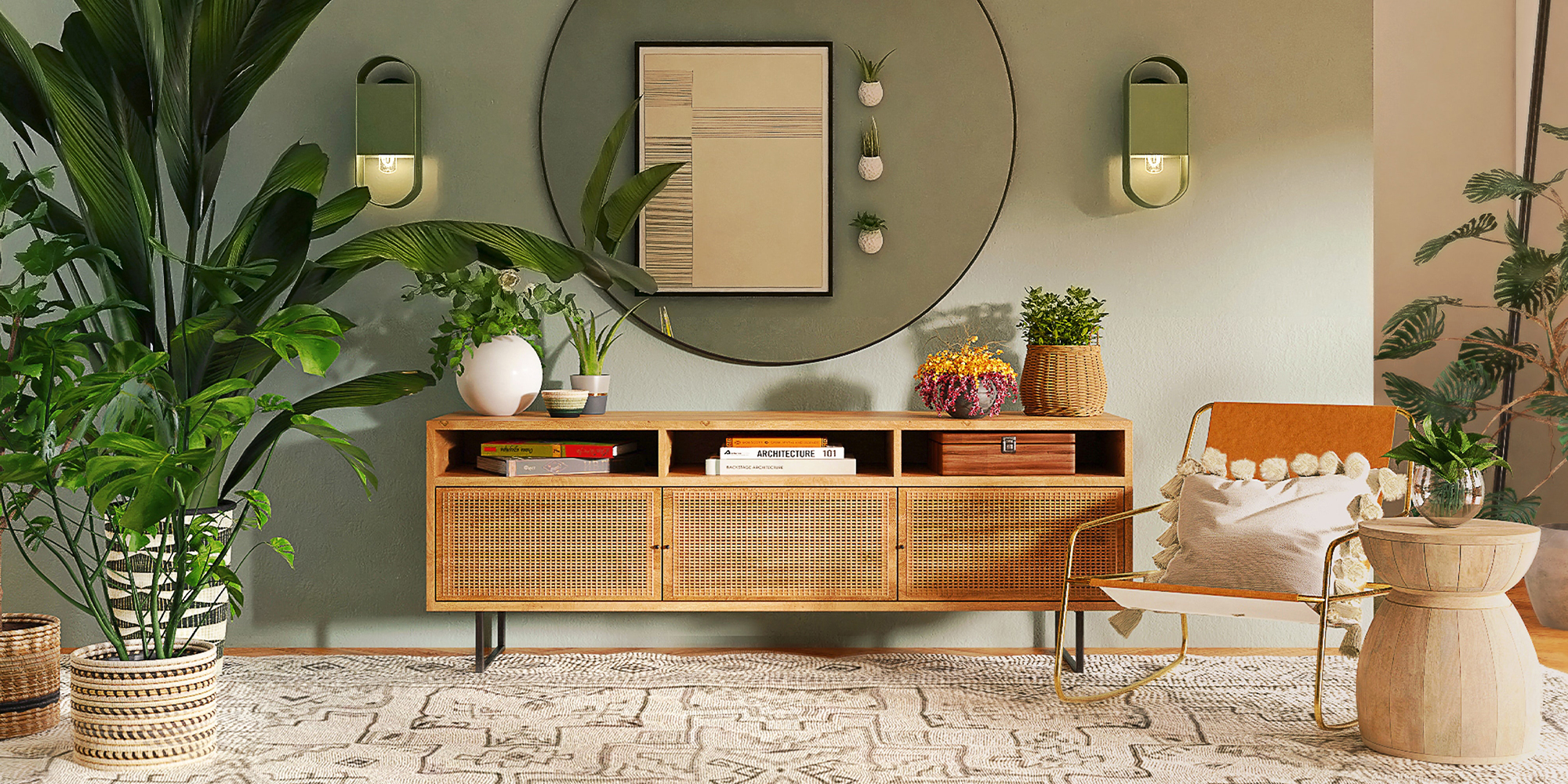 credenza with large round mirror above it, a wall sconce and a large leaf plant next to it.